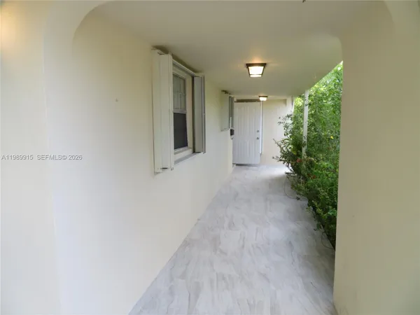 a view of a hallway with entryway