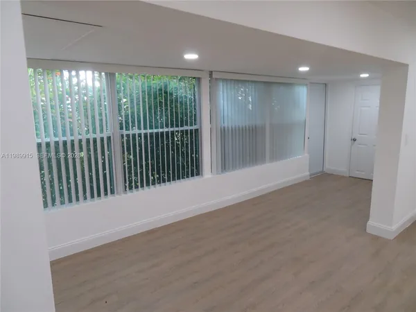 a view of an empty room with a sliding door