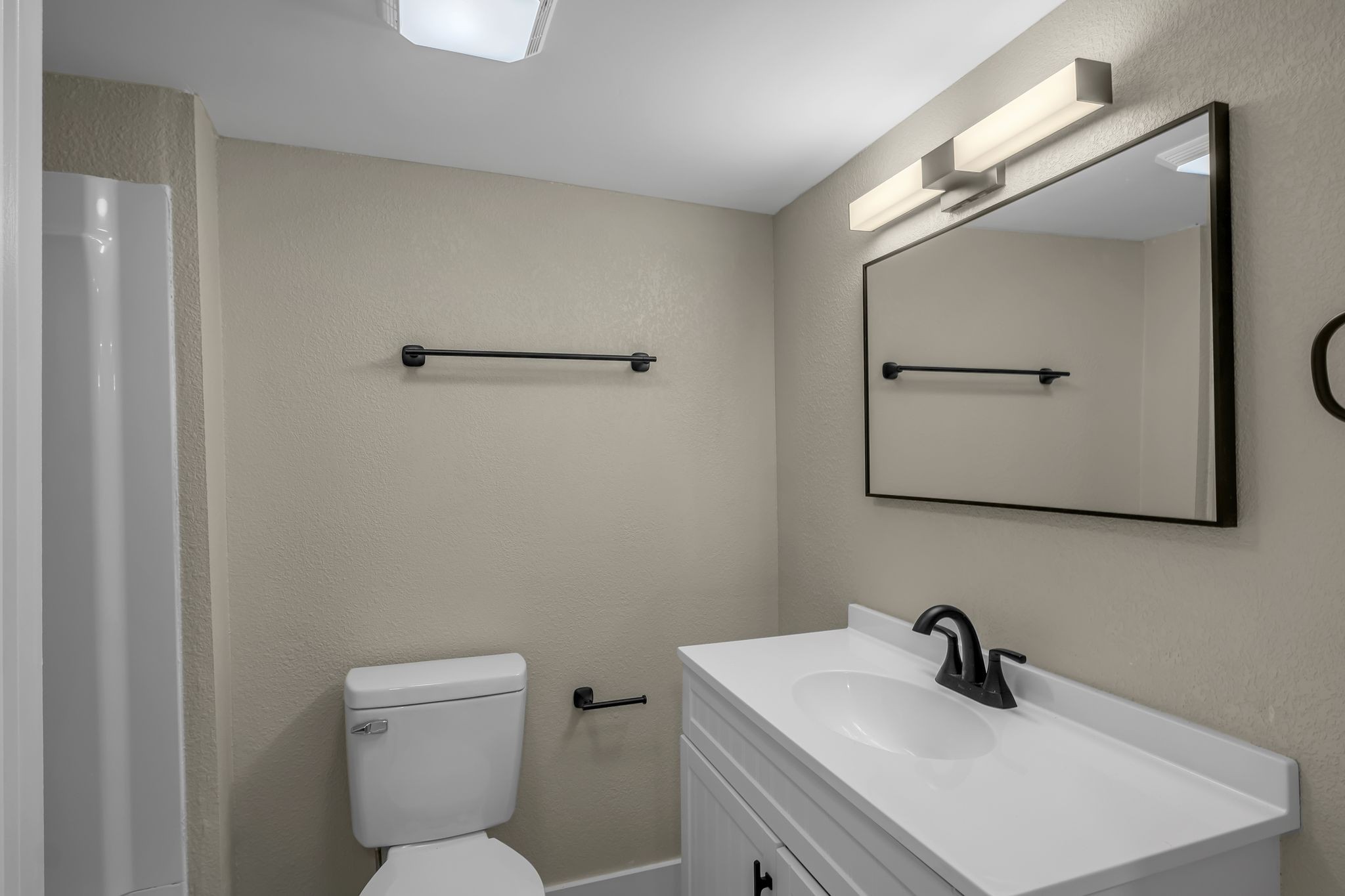 403 Carpenter Street Mount Pleasant, TN 38474 - Photo 29 of 34 a bathroom with a toilet a sink and mirror