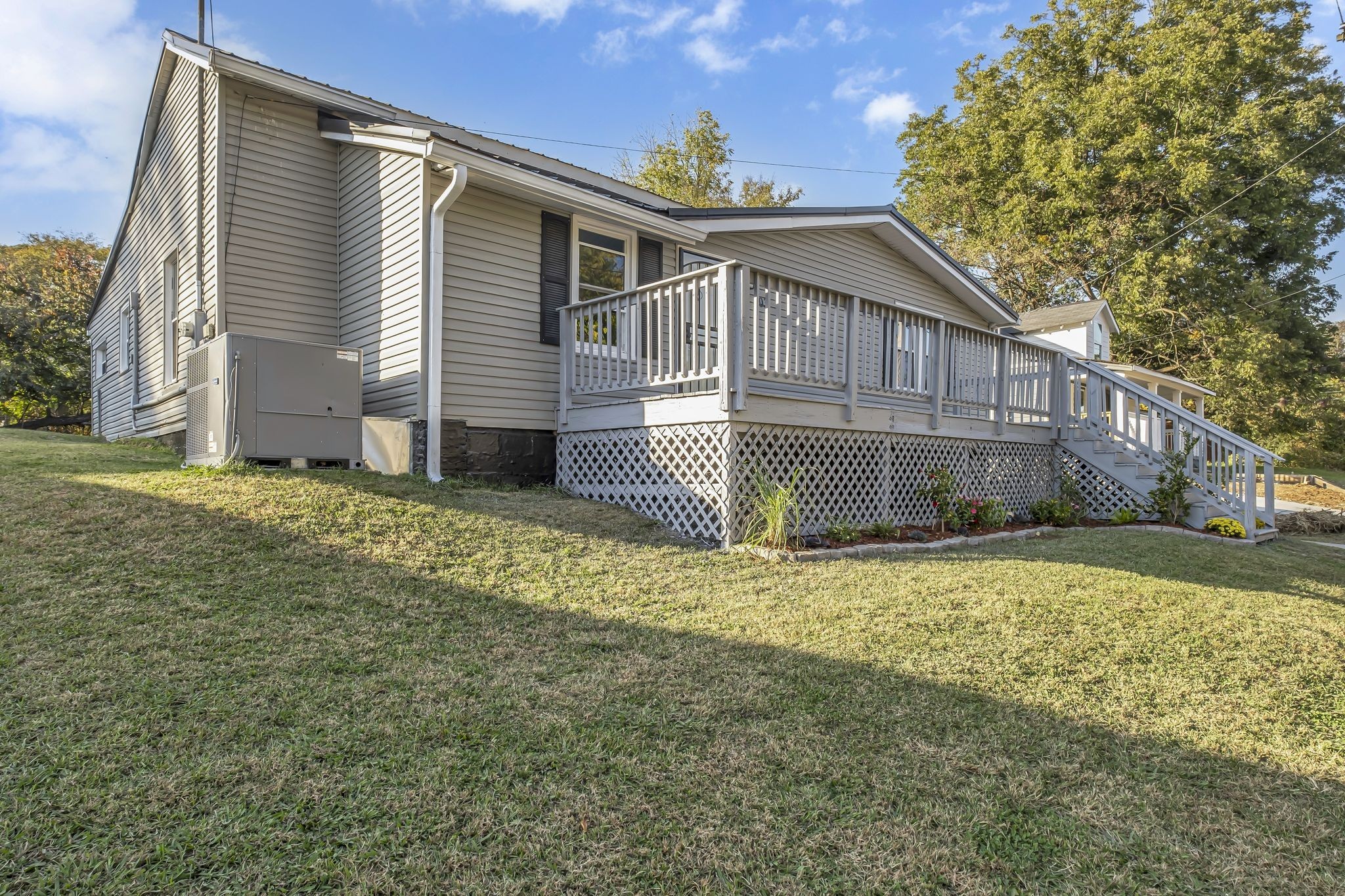 403 Carpenter Street Mount Pleasant, TN 38474 - Photo 3 of 34 a view of a house with a yard