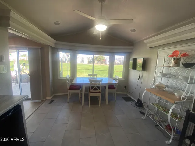 a kitchen with a sink and a stove top oven with wooden floor