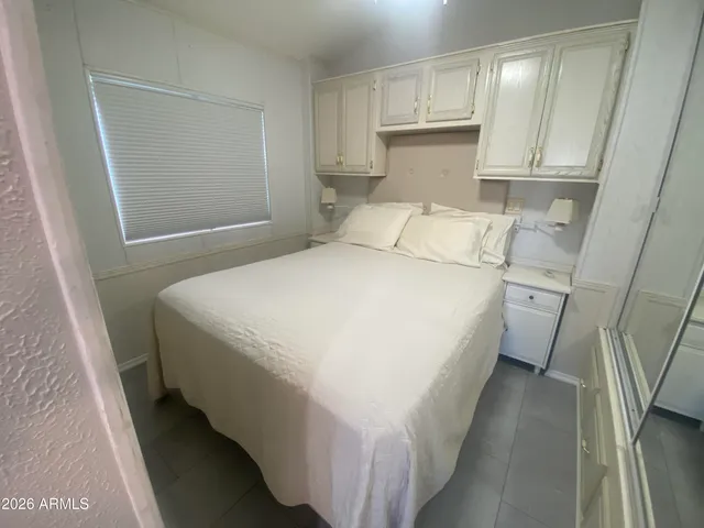 a view of a big house with a garden