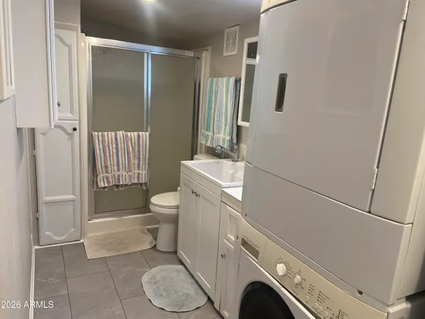 a bathroom with a sink and a washing machine