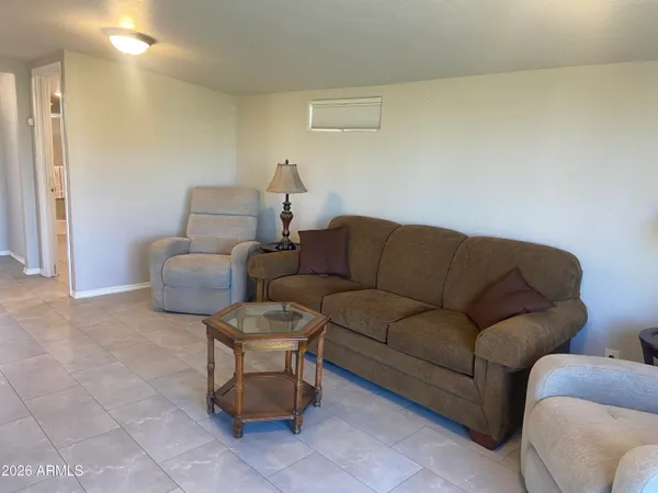 a living room with furniture and a couch
