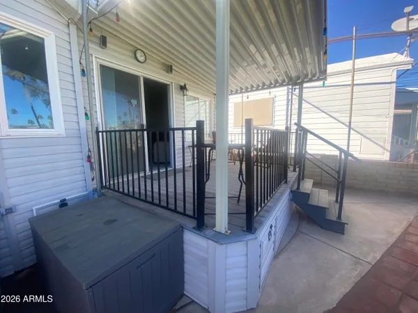 a view of entryway with wooden floor and fence