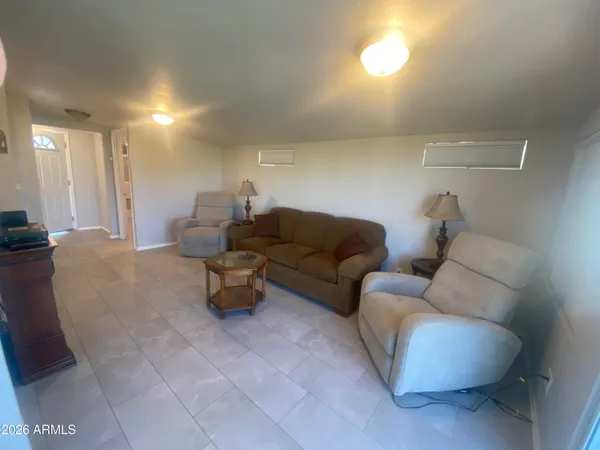 a living room with furniture and a couch
