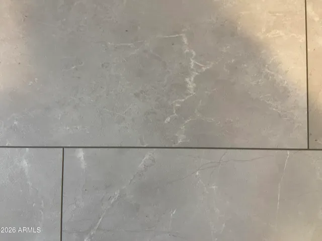 a living room with a fireplace and a flat screen tv