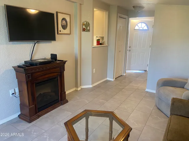 a view of a dining room with furniture and window