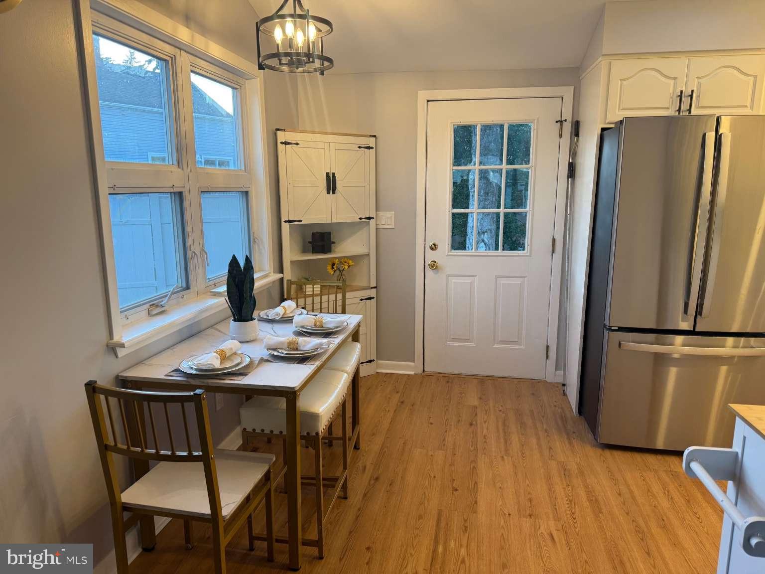 2 Tekening Way Hamilton, NJ 08690 - Photo 11 of 31 a view of a dining room with furniture window and wooden floor