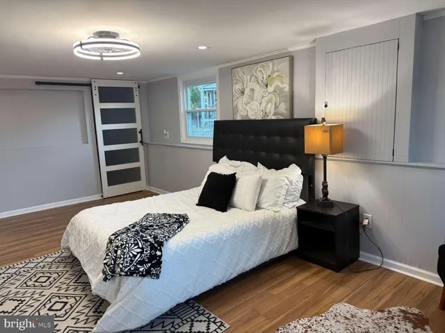 a bedroom with bed and window