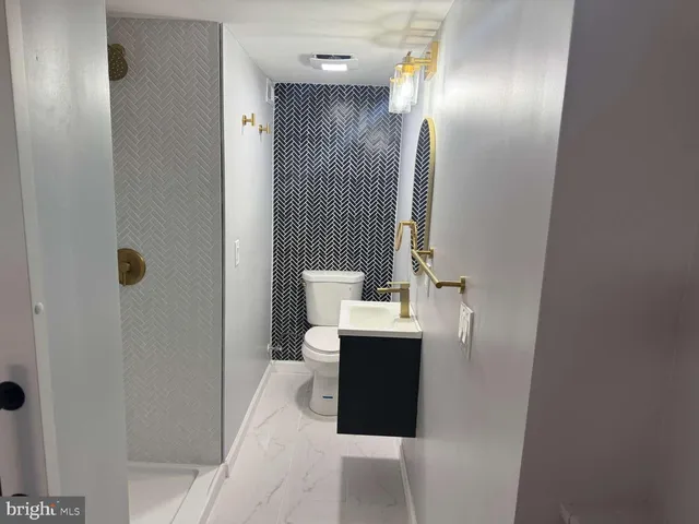 a bathroom with a sink and mirror