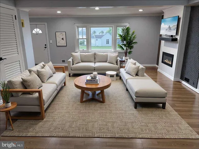 a living room with furniture and a rug