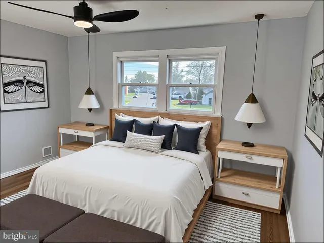 a bedroom with bed and window