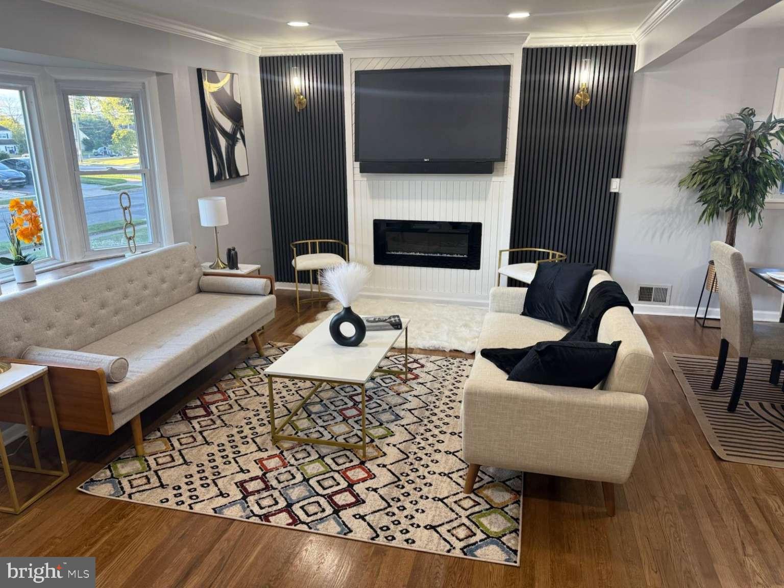 2 Tekening Way Hamilton, NJ 08690 - Photo 4 of 31 a living room with furniture and a flat screen tv