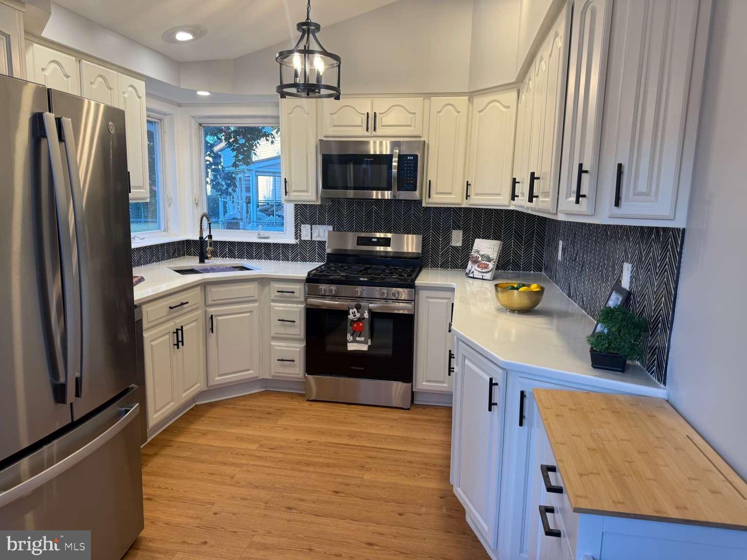 2 Tekening Way Hamilton, NJ 08690 - Photo 10 of 31 a kitchen with stainless steel appliances granite countertop a refrigerator a stove top oven a sink and dishwasher