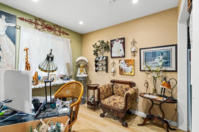 a view of a livingroom with furniture and a gym