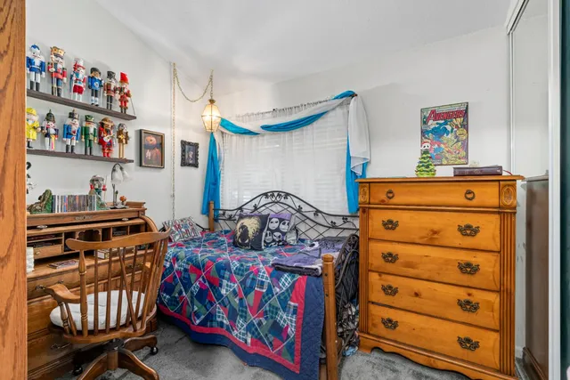 a bedroom with a bed and furniture