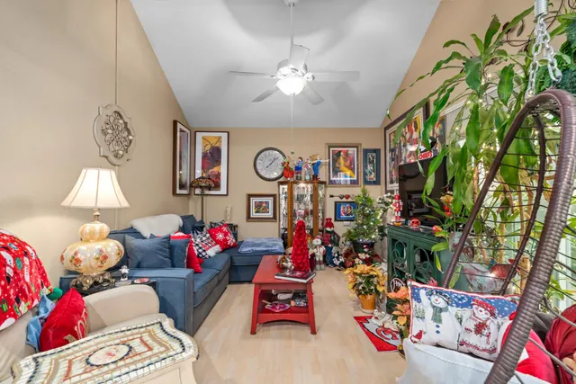 a living room with lots of furniture and a chandelier
