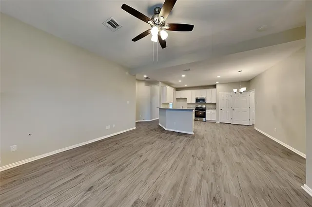 a view of kitchen with wooden floor and window
