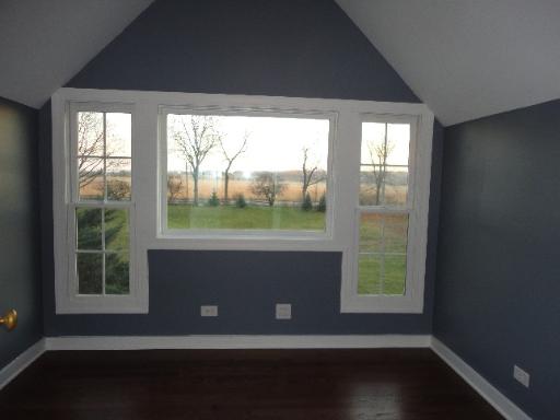 32W630 Army Trail Road Wayne, IL 60184 - Photo 12 of 16 an empty room with wooden floor and windows