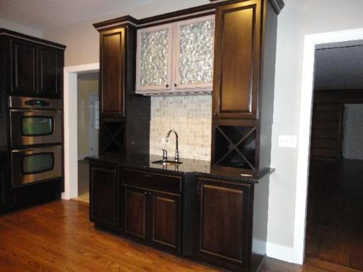 32W630 Army Trail Road Wayne, IL 60184 - Photo 6 of 16 a kitchen with a refrigerator and a sink
