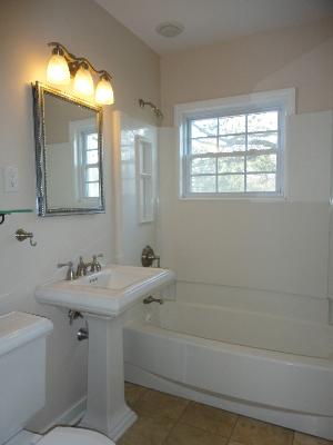 32W630 Army Trail Road Wayne, IL 60184 - Photo 9 of 16 a bathroom with a sink mirror and a bathtub
