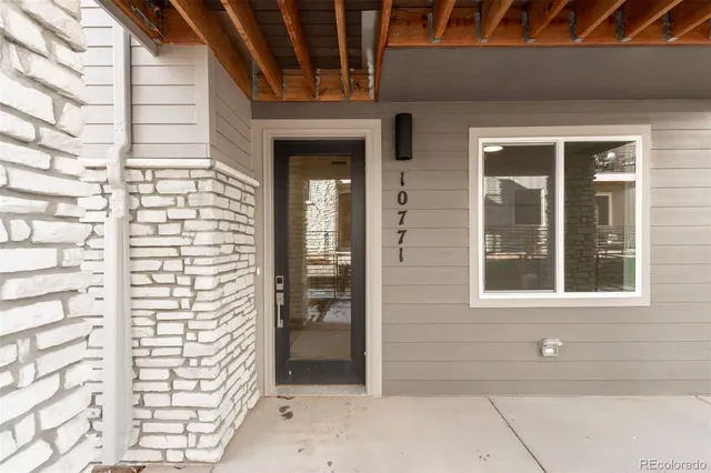 a view of front door of house with a window
