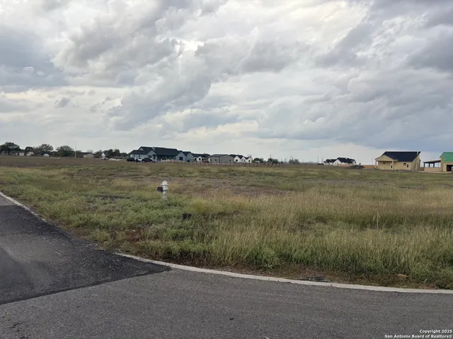 a view of a lake with a big yard