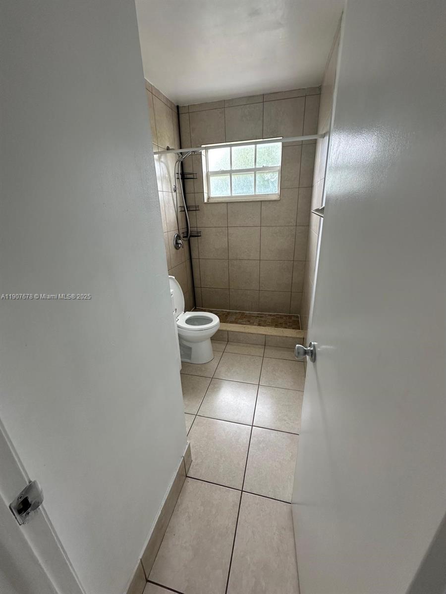 431 East 28th Street, Unit 3 Hialeah, FL 33013 - Photo 3 of 8 a bathroom with a toilet and a shower