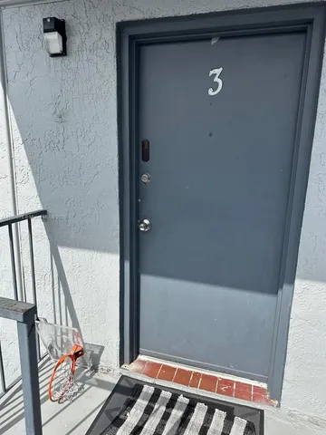 a view of a livingroom with an empty space and a window