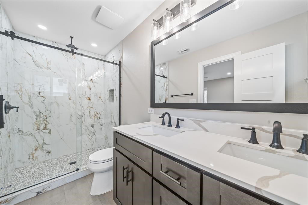 23307 Apple Arbor Drive Spring, TX 77373 - Photo 15 of 32 a bathroom with a sink a toilet and shower