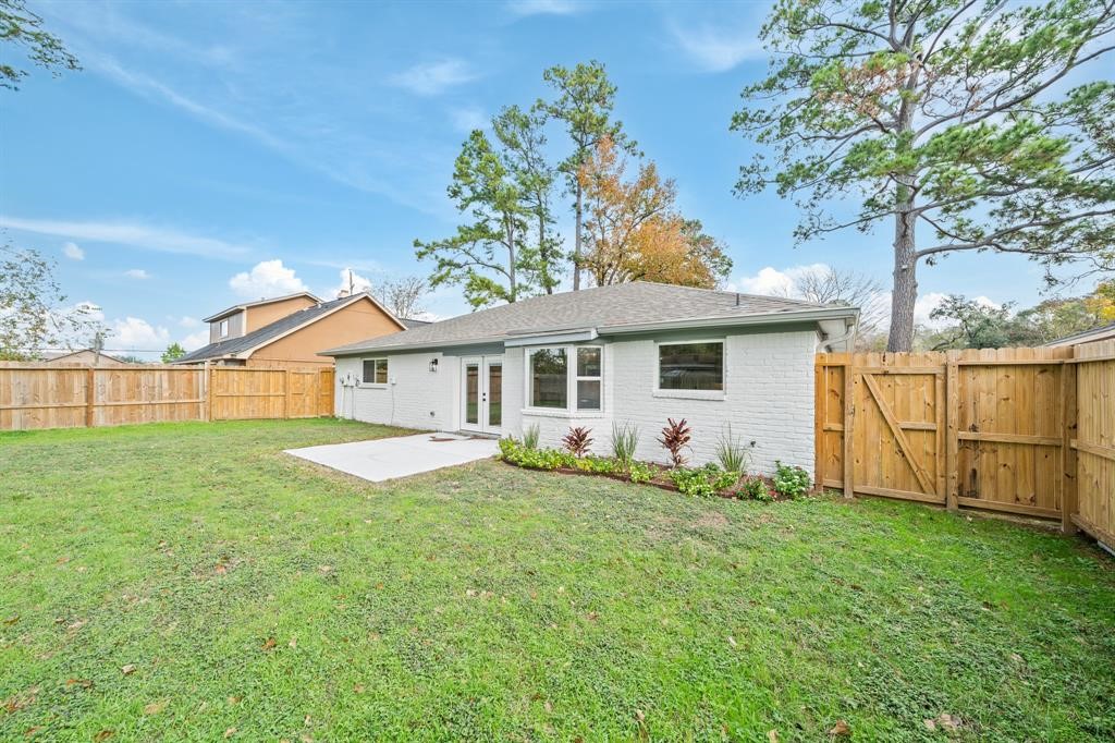 23307 Apple Arbor Drive Spring, TX 77373 - Photo 18 of 32 a front view of a house with a garden and yard