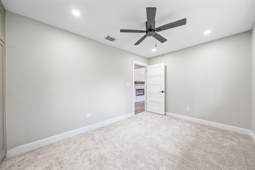 23307 Apple Arbor Drive Spring, TX 77373 - Photo 19 of 32 a view of an empty room with a ceiling fan