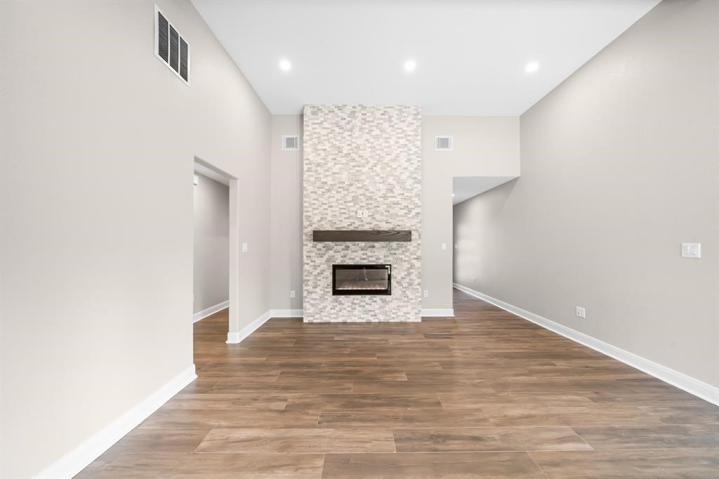 23307 Apple Arbor Drive Spring, TX 77373 - Photo 27 of 32 a view of an empty room with a fireplace and a window