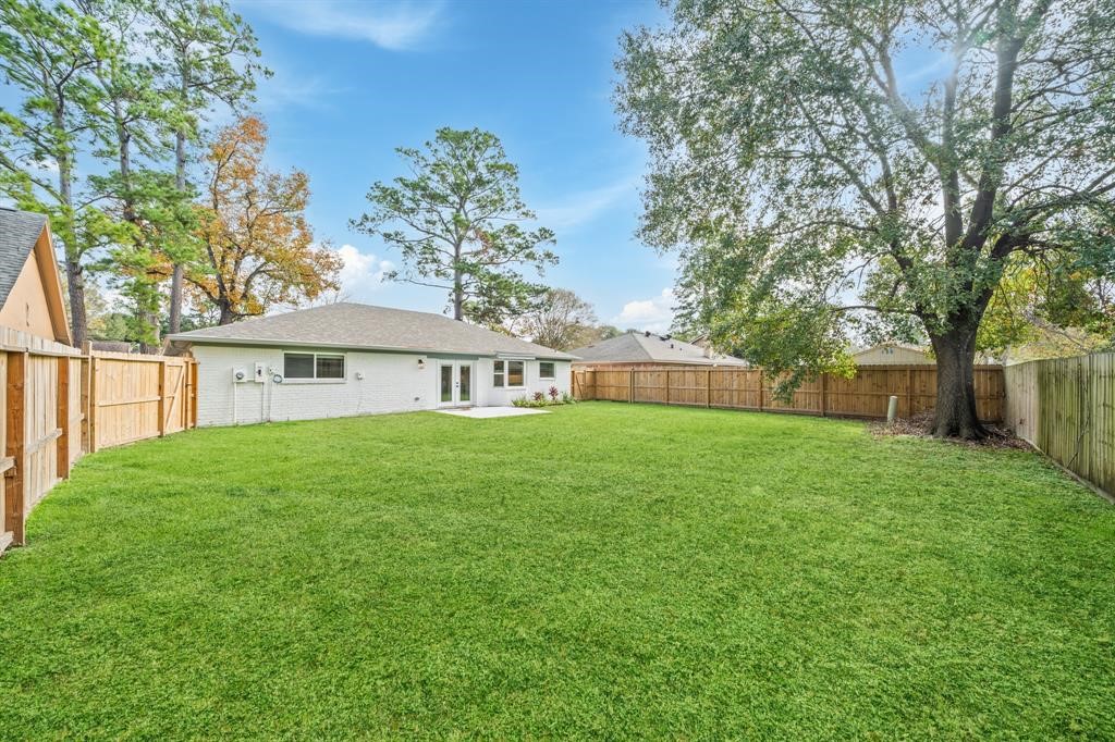 23307 Apple Arbor Drive Spring, TX 77373 - Photo 8 of 32 a view of a house with backyard and garden
