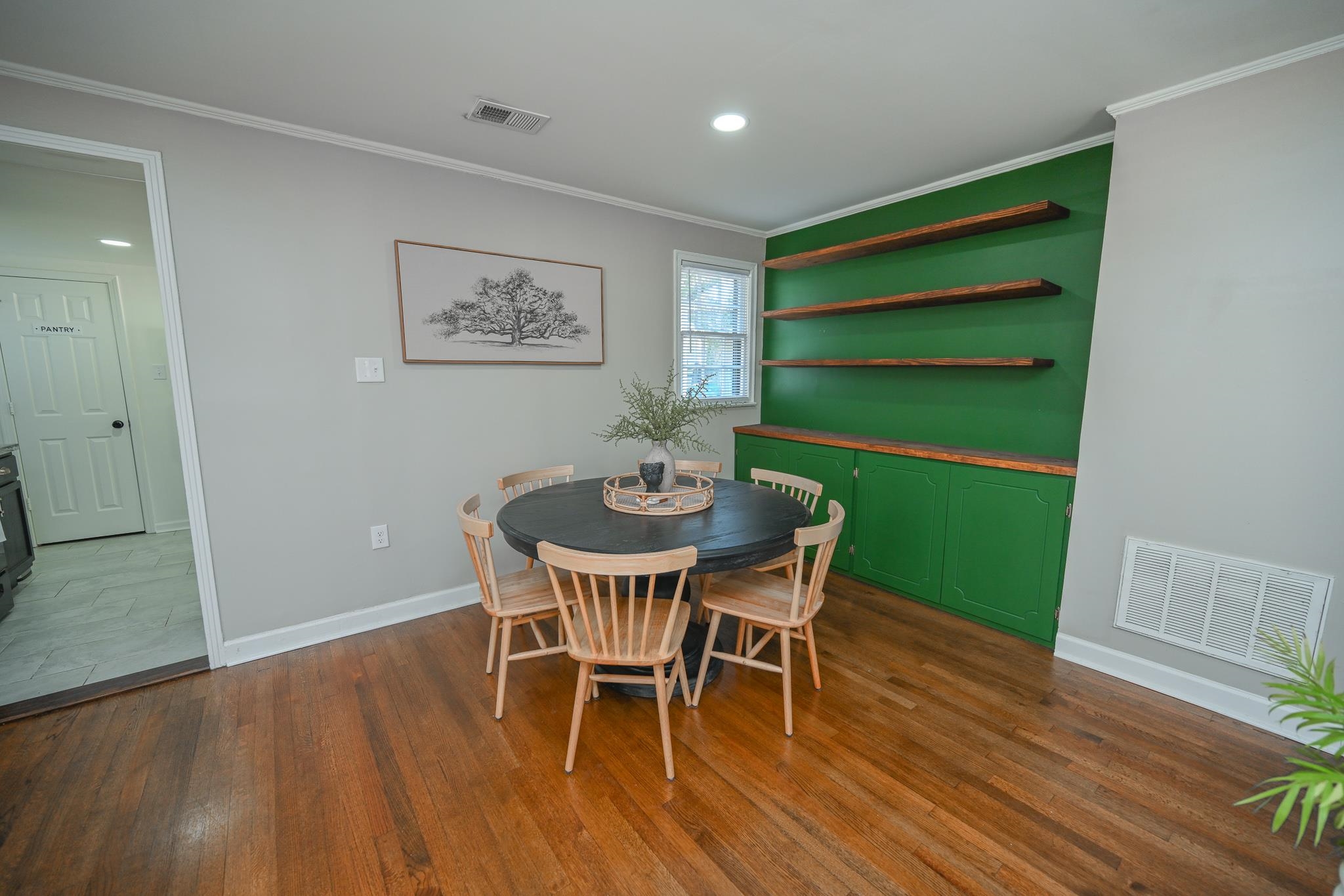 1105 Stratford Road Memphis, TN 38122 - Photo 11 of 26 Dining area featuring ornamental molding, dark wood-style floors, and recessed lighting