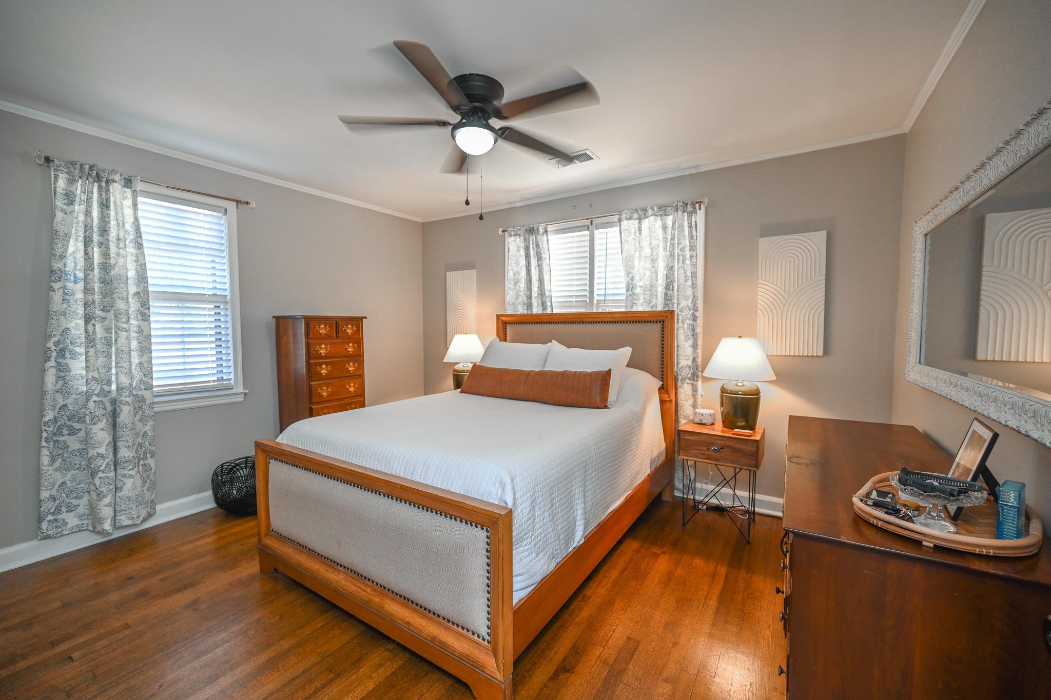 1105 Stratford Road Memphis, TN 38122 - Photo 13 of 26 Bedroom featuring wood finished floors, ornamental molding, multiple windows, and a ceiling fan