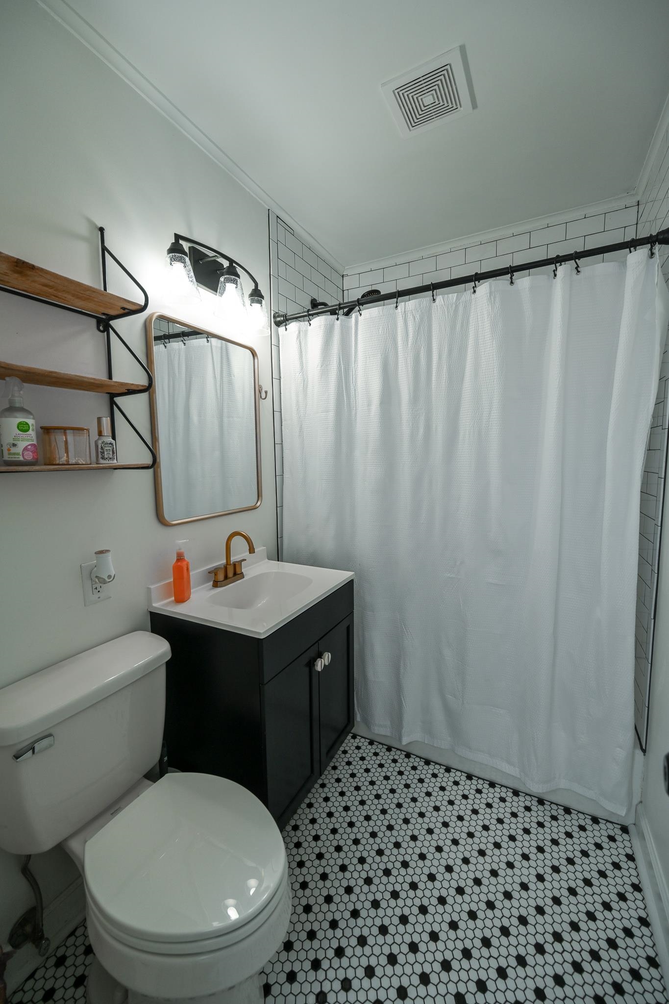 1105 Stratford Road Memphis, TN 38122 - Photo 16 of 26 Full bathroom featuring vanity and ornamental molding