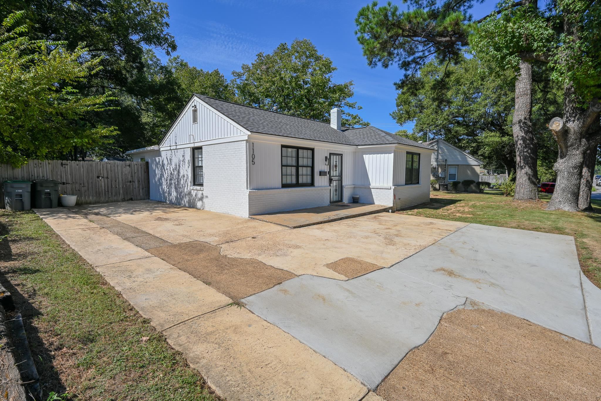 1105 Stratford Road Memphis, TN 38122 - Photo 2 of 26 View of front of property with brick siding, a chimney, a shingled roof, and a patio