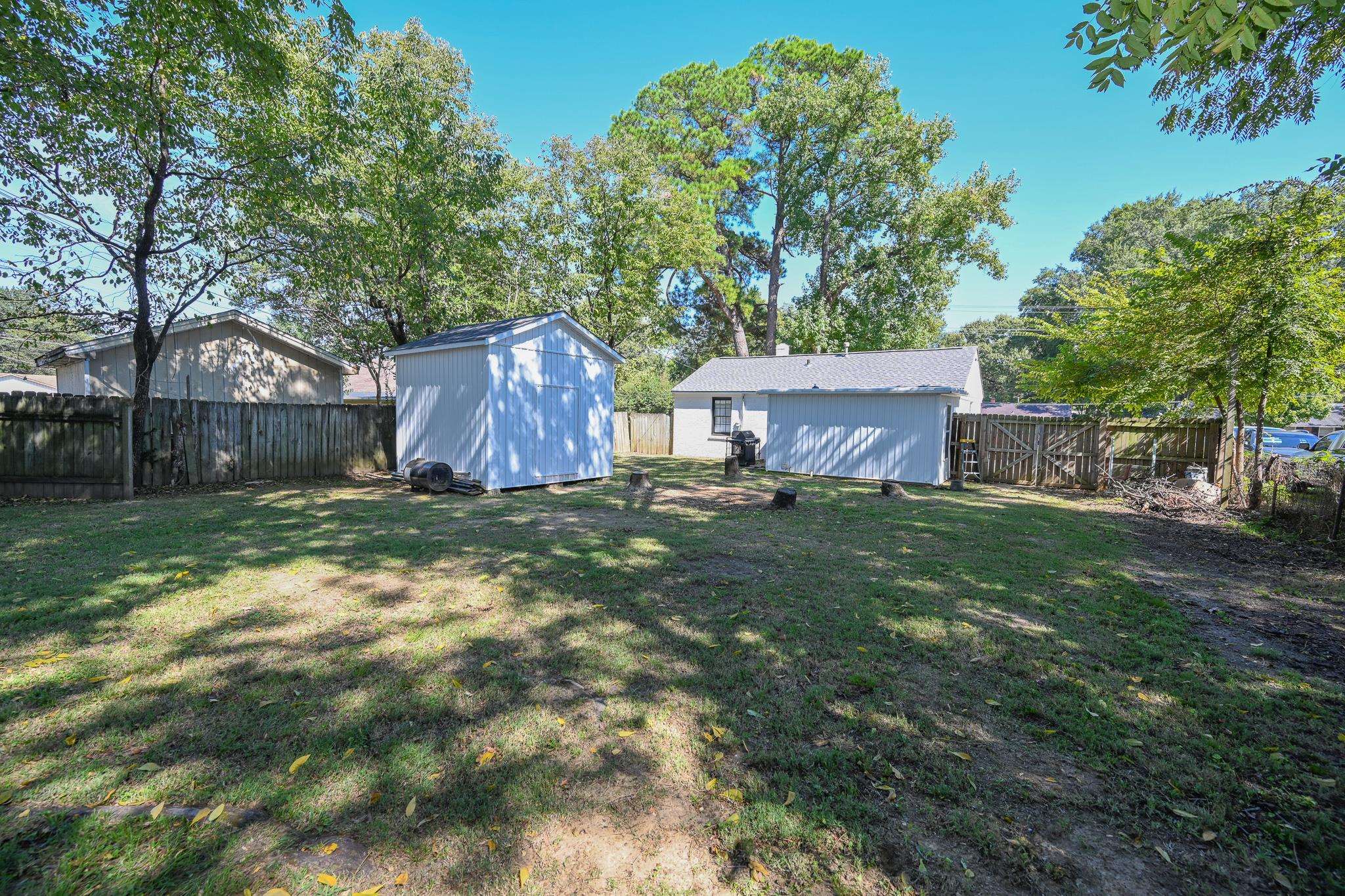 1105 Stratford Road Memphis, TN 38122 - Photo 26 of 26 Fenced backyard with a shed