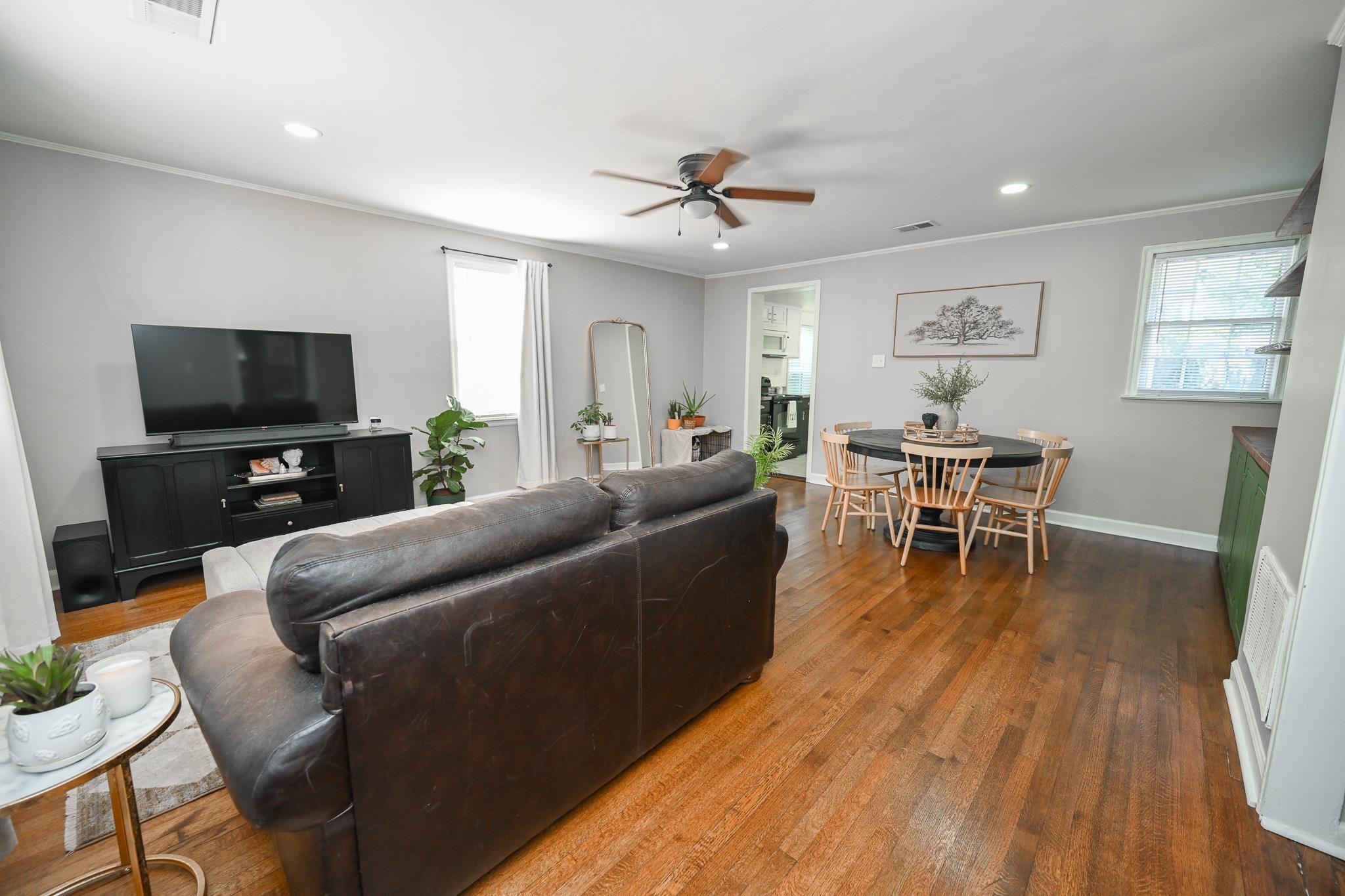 1105 Stratford Road Memphis, TN 38122 - Photo 5 of 26 Living area with ceiling fan, ornamental molding, plenty of natural light, dark wood-type flooring, and recessed lighting