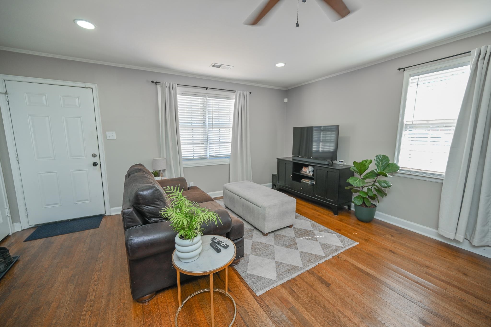 1105 Stratford Road Memphis, TN 38122 - Photo 9 of 26 Living room featuring crown molding, wood finished floors, recessed lighting, and ceiling fan