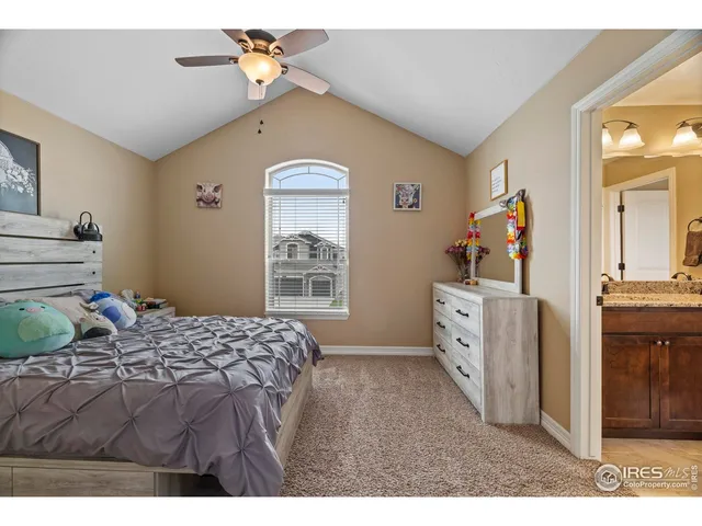 a bedroom with a bed dresser and a window