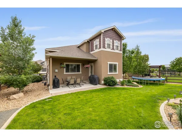 a front view of a house with garden and porch