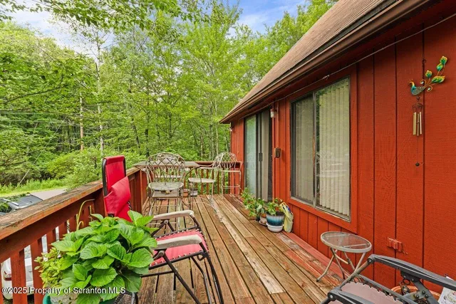 a view of balcony with furniture