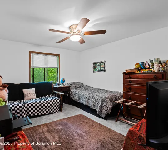 a living room with a couch and a window