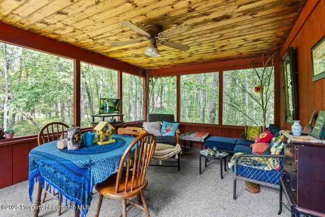 a outdoor dining space with furniture and garden view