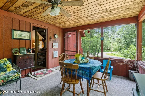 a outdoor dining space with furniture and garden view