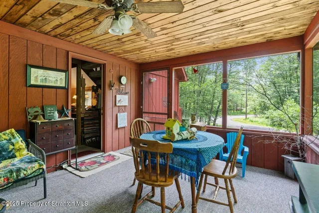 a outdoor dining space with furniture and garden view