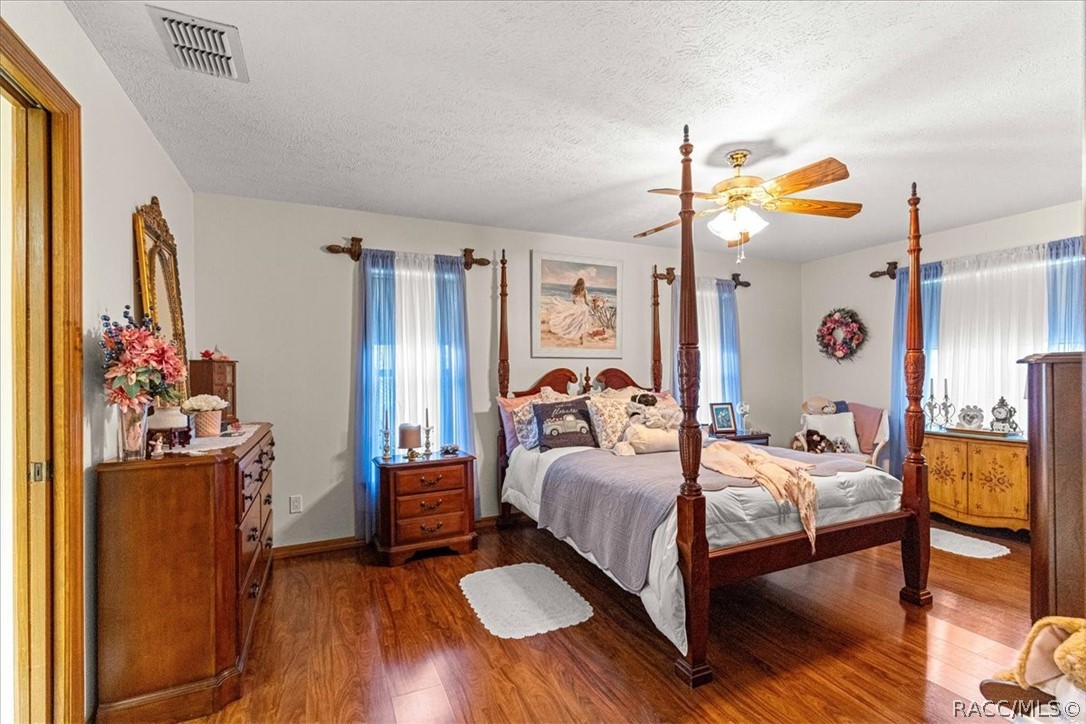 2964 South Cygnet Terrace Inverness, FL 34450 - Photo 22 of 67 a bedroom with a bed and wooden floor